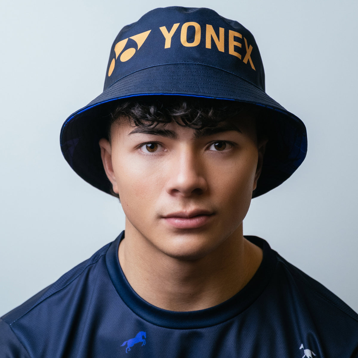 Yonex Legend’s Crown – Reversible Bucket Hat (Ink Blue | Celestial Purple / Pale Gold) Yonex CNY2026 Reversible Bucket Hat A Unisex Celestial Purple Pale Gold Ink Blue Clothing Yonex