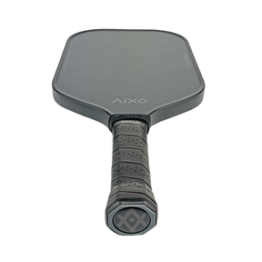 Flat-lay image of AIXO Ghost Ultra Noir — a sleek black pickleball paddle for spin-focused players.
